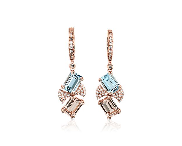 Shimmering diamond accents lend splashes of sparkle around the dangling emerald-cut aquamarine and morganite stones of these stunning drop earrings.  The warm 14k rose gold  beautifully matches the soft hues of the stones.