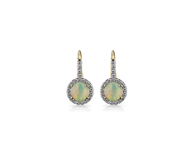 Crafted into a versatile round shape, these delicate opal lever-back earrings exude timeless glamour that’s elevated by a surrounding halo of micro-pavé diamonds set in brilliant 14k yellow gold.