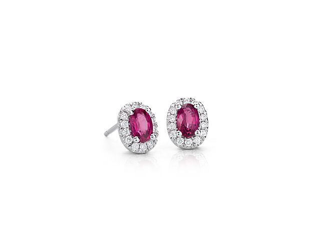 Striking red oval rubies are the centerpiece to these captivating stud earrings. Each richly colored gemstone is encircled by a brilliant halo of pavé diamonds, petite enough to wear every day but distinct enough to stand out.