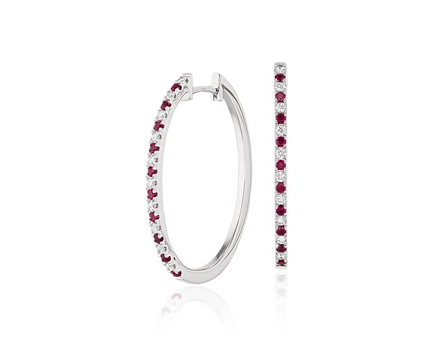 These slender hoops of shining 14k white gold, feature a refined rows of alternating rubies and twinkling round diamonds.