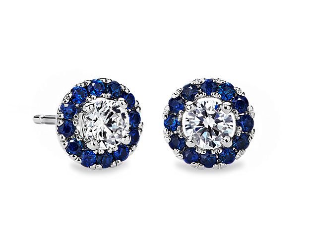 These classic 14k white gold earring settings will maximize the brilliance of your choice of round diamonds. Each earring is pavé-set with blue sapphire gemstones.