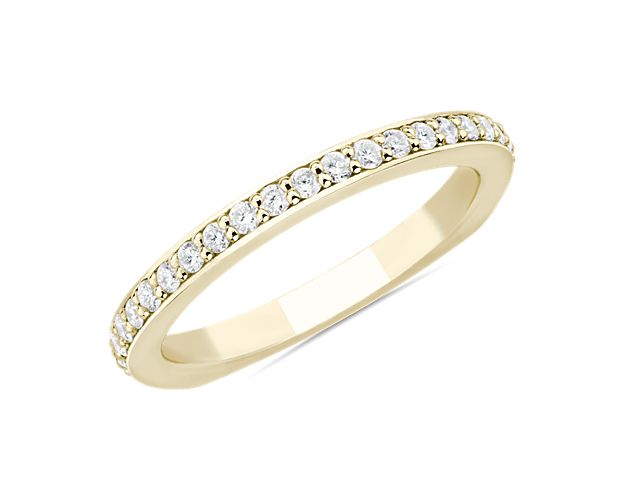 Bright diamonds bring dramatic sparkle to this breath-taking Bella Vaughan wedding band. The gleaming 18k yellow gold design features an elegant Euro shank shape that give it contemporary allure.