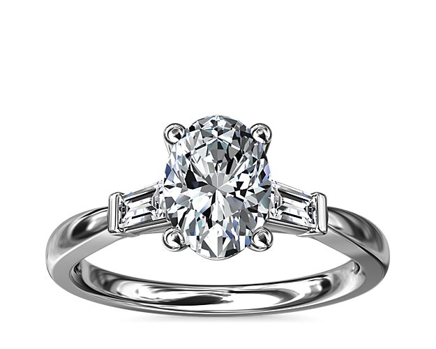 Classic and timeless, this engagement ring features two dazzling tapered baguettes that frame your choice of center stone beautifully.