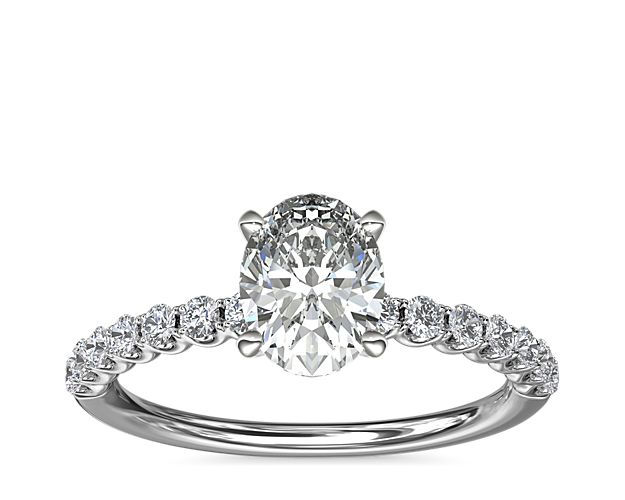 Express your love with this timeless Selene engagement ring that highlights your chosen center stone in a gleaming platinum setting. The U-shaped profile features a shimmering array of accent diamonds along the band.