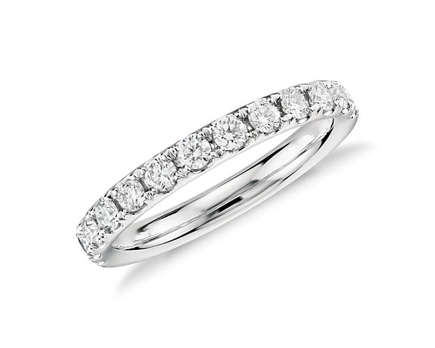 A row of sparkling round brilliant diamonds shimmer brightly, pavé-set in this 14k white gold ring she'll treasure as a wedding or anniversary band.