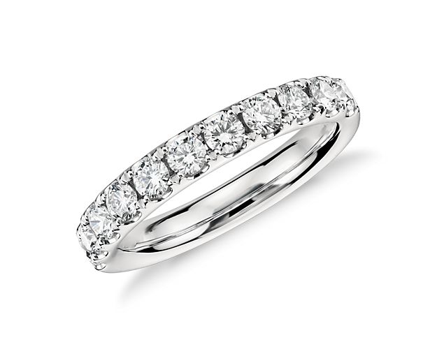 A pavé-set row of sparkling round brilliant diamonds shimmer brightly in this 14k white gold ring she'll treasure as a wedding or anniversary band.