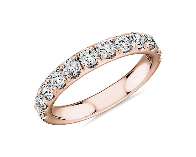 Shine bright with the elegant beauty of this 14k rose gold diamond ring adorned with a row of dazzling pavé-set round diamonds.