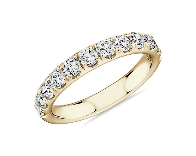 Shine bright with the elegant beauty of this 18k yellow gold diamond ring adorned with a row of dazzling pavé-set round diamonds.